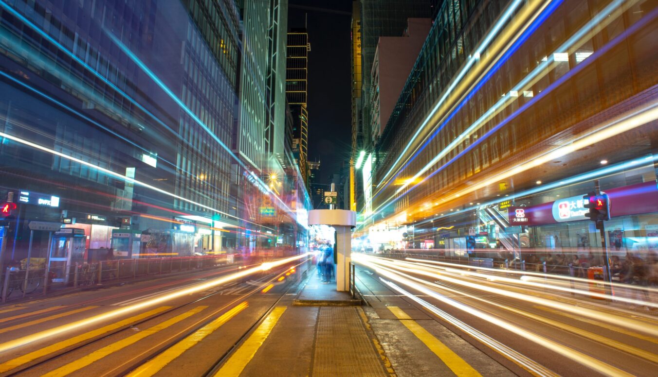 Photograph of nighttime in a city with slow exposure light streaks